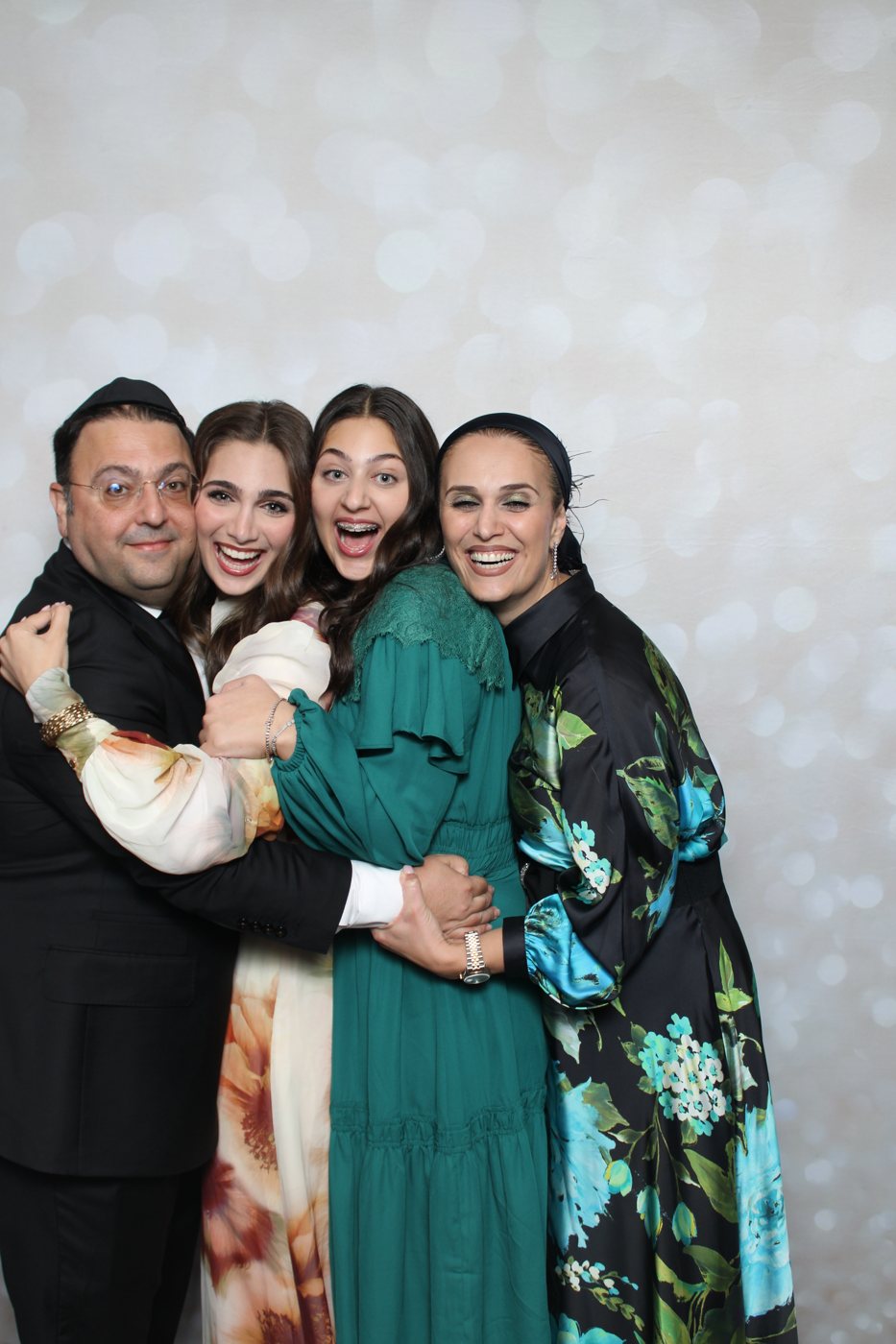 A family posing together at the Beverly Booth